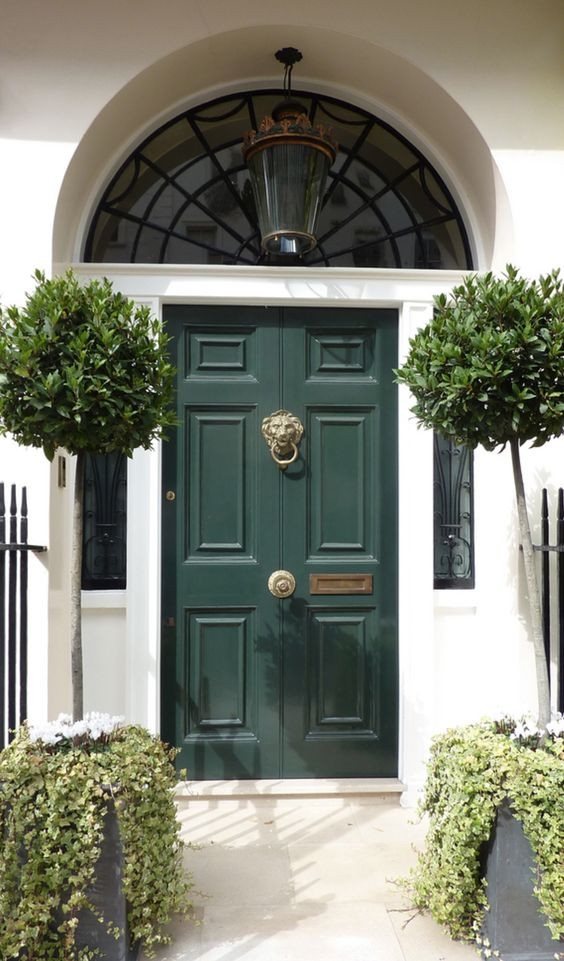 Green front door with brass lion knocker. Symmetrical buxus | Pink flowers with mint green front door | Interior design studio | Interior design blog | Interior designer | What does your front door colour say about you