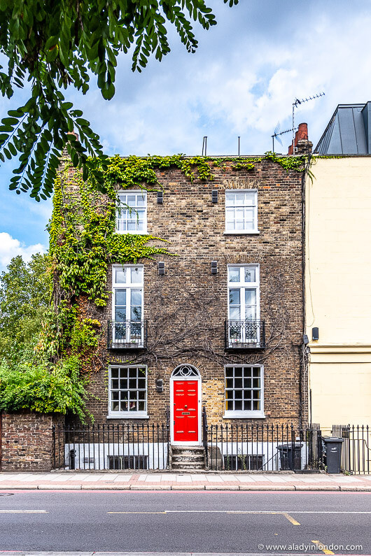 The red front door makes this terraced Victorian property! The dramatic impact it has is all attributed to the strong red front door paint | Photo credit Instagram @aladyinlondon