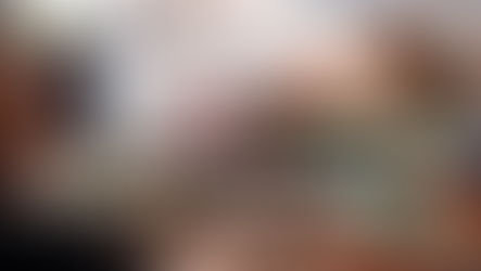 A smiling woman receives a plate of food from a vendor over a brick counter inside a busy, casual market or eatery, perfectly illustrating the Curacao Local Food Guide experience: Where to Eat Like a Local & Taste the Real Curacao