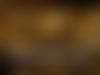 Tourists on a lit pathway inside a large, glowing cave, with the text 'Top Cave Exploration Tours in Curaçao You Must Experience.