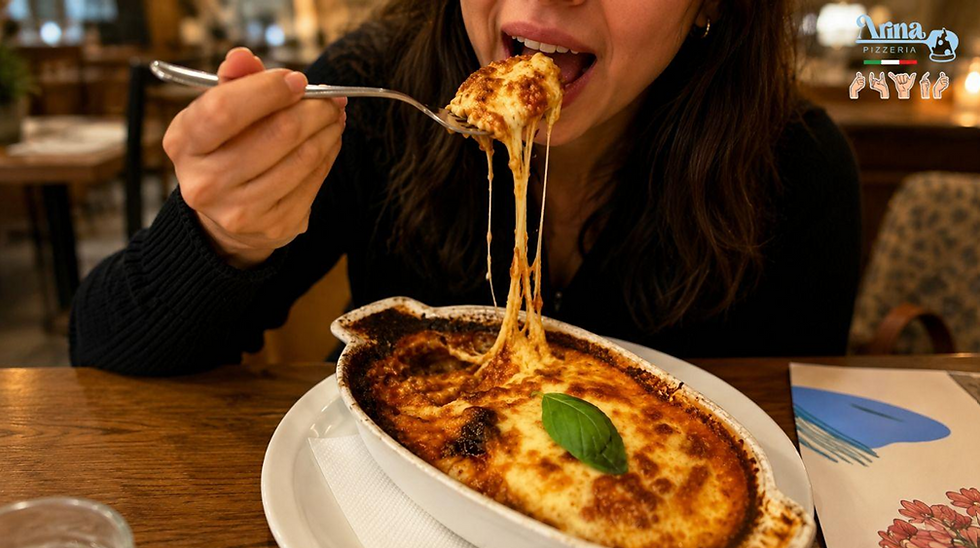 Customer enjoying Melanzane Alla Parmigiana at Arina Pizzeria, a classic of authentic Italian cuisine in Saudi Arabia