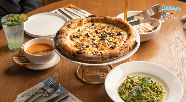 Authentic Italian pizza and pasta served at Arina Pizzeria, reflecting quality dining at Italian pizza restaurants in Saudi Arabia