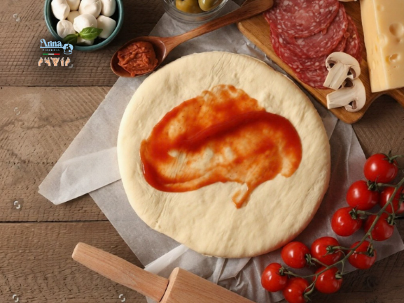 Preparing dough for authentic Neapolitan pizza in Saudi Arabia with fresh ingredients and traditional Italian methods
