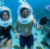 Non-swimmers enjoying Sea Trek in Curaçao while walking underwater among tropical fish and coral reefs