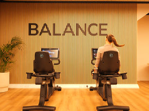 A girl on a Pulse Fitness bike
