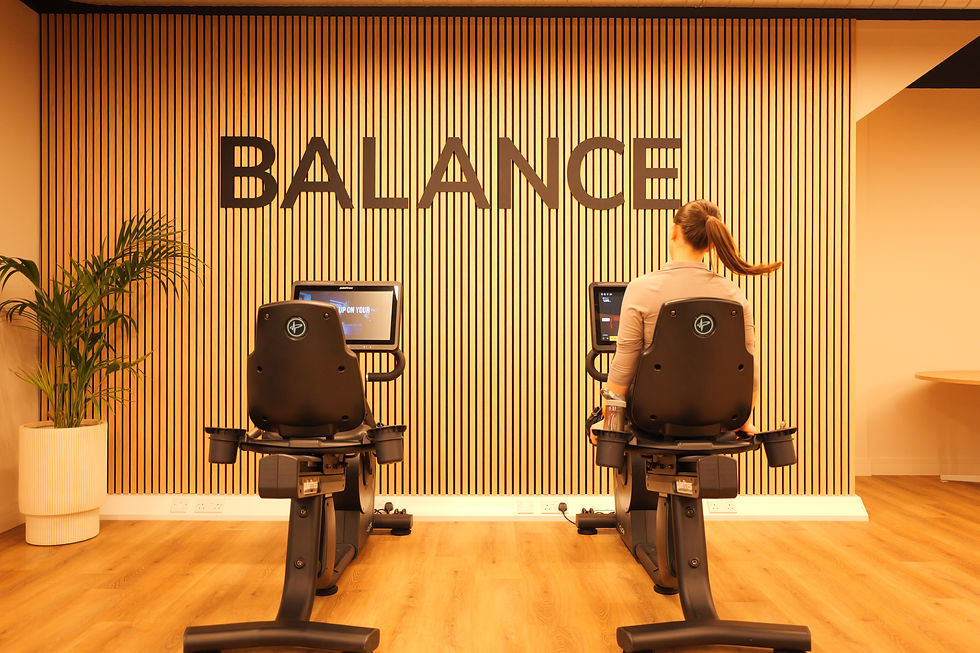 A girl on a Pulse Fitness bike