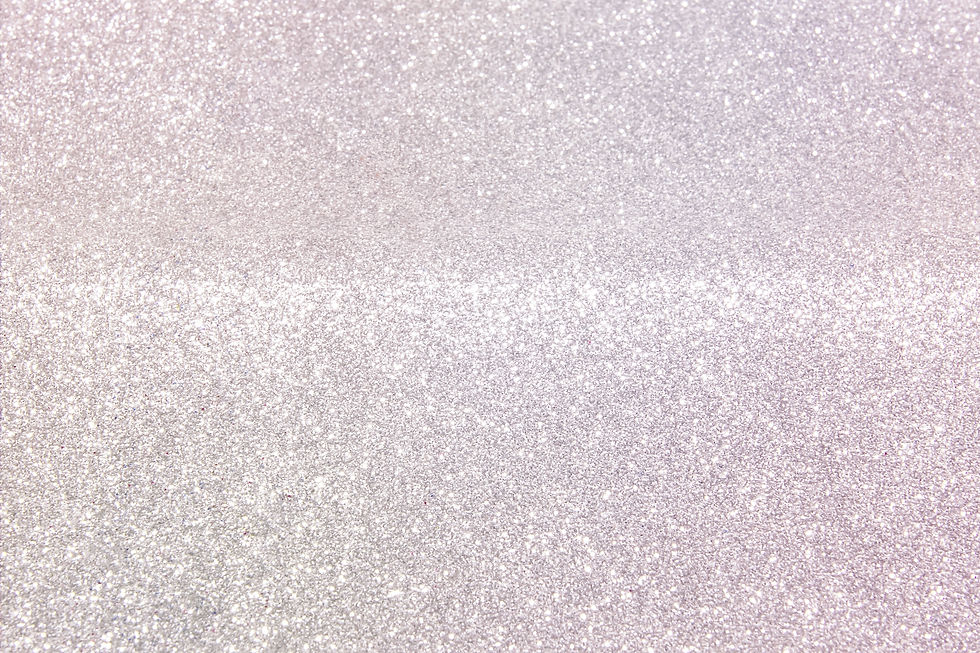 Shiny light pearlescent background made of fine glitter dust Light festive background for 