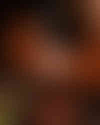 Trozo de carne a término medio sostenido con tenedor en Fuego Asador.