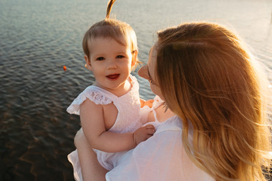 a mother holding her toddler during a family photography session in the sutherland shire
