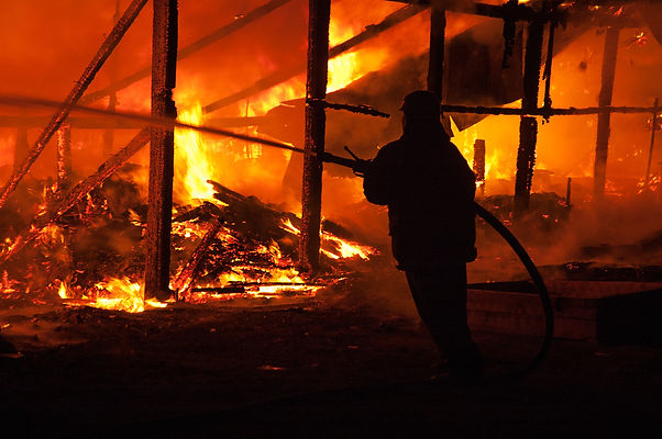 Firefighters extinguish a house.jpg