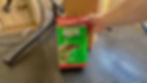 Team members holding a 5-liter can of Swarfega Jizer cleaner with excitement.