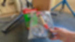 Close-up view of the parts washer's brush with hose attachment.