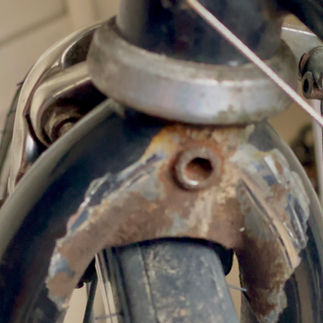Rusty forks in need of restoration on a vintage Bianchi Gold Race Special bike.