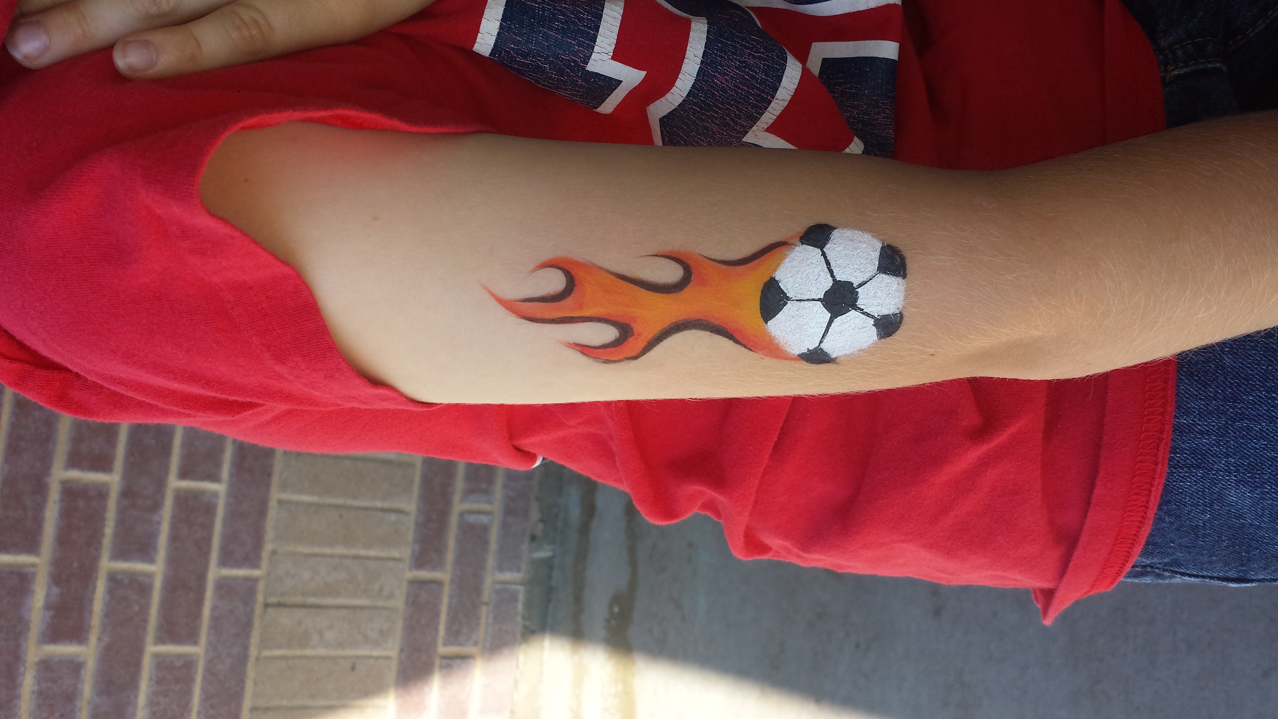 Flaming soccer ball arm paint