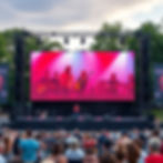 Video Wall on a concert stage, in an outdoor park, with the Band IMAG on the video wall.jp