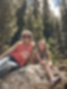 Courtney Munichiello with her sweet daughter smiling in the woods
