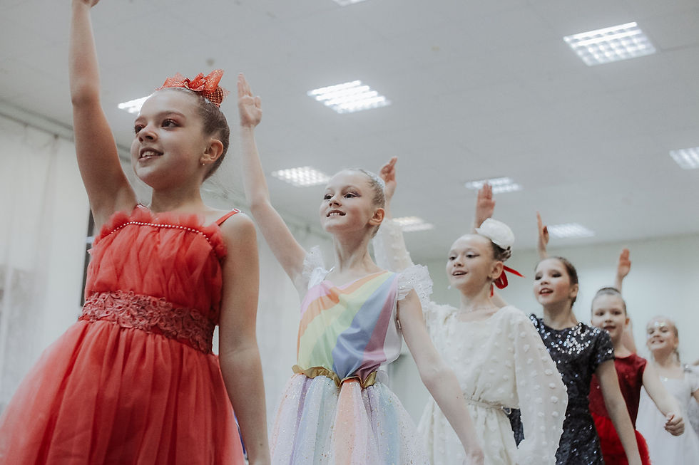 Young dancers in colorful competition costumes celebrating together, capturing the excitement, teamwork, and memorable moments of dance competition season.