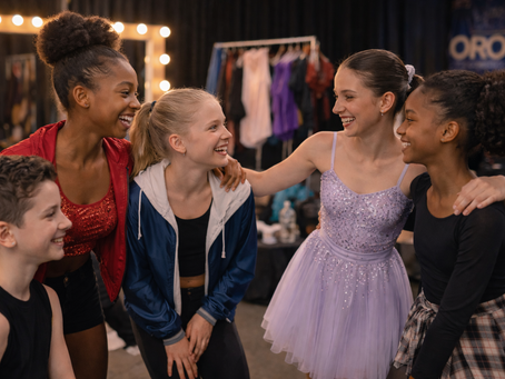 Dancers from different studios sharing a friendly moment backstage at Oro Dance Competition.