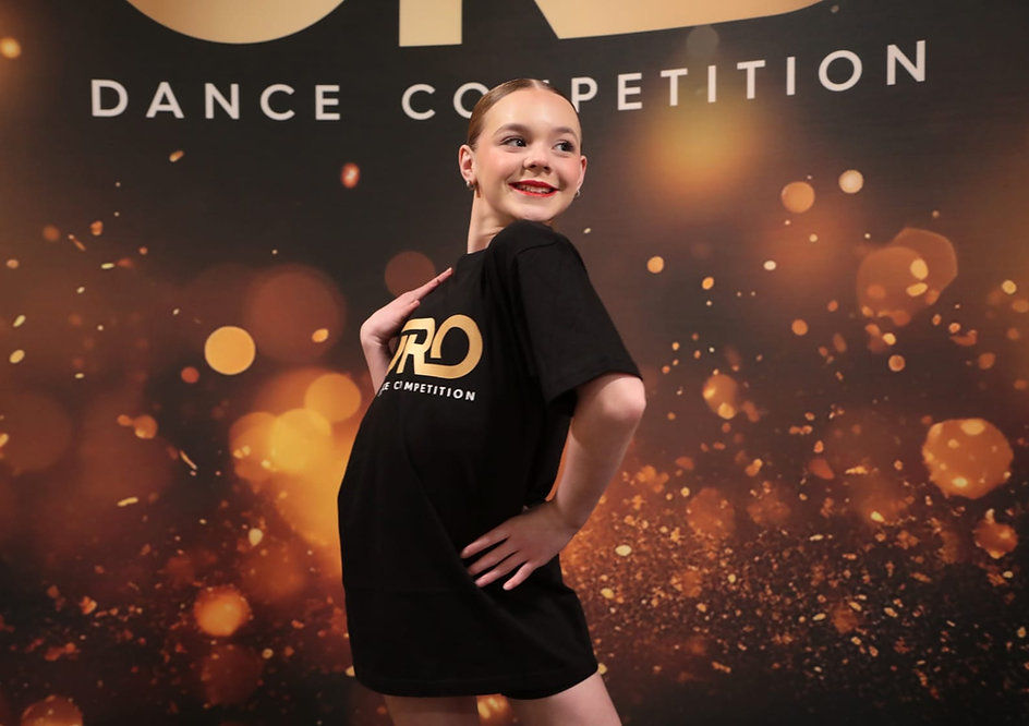 Eye-level view of a dance studio's welcoming lobby decorated with colorful banners and seating
