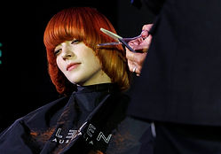 A person getting their hair coloured