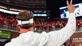 Coach waving