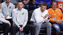 two coaches on bench