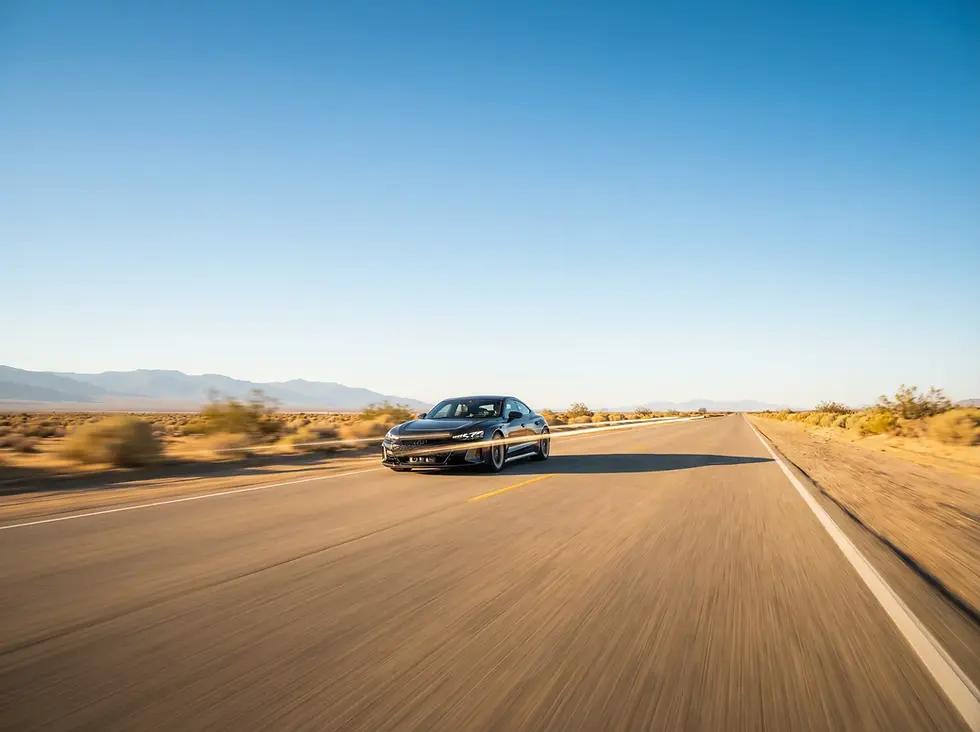Professional automotive photography of a car on an expansive open highway, illustrating high-precision outdoor GPS satellite tracking with no signal obstructions.