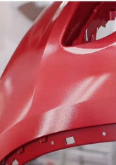 Red fender inside temperature-controlled spray booth at HJ Bosch & Sons.	