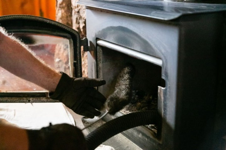 Hand Holding Chimney Brush