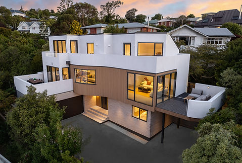A luxury residential property in Cashmere, Christchurch, photographed at twilight with aerial drone photography, showing the home’s architecture, landscaped surroundings and elevated hillside setting.