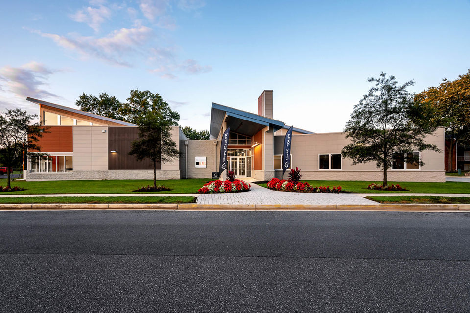 Modern commercial building with landscaped garden and walkway