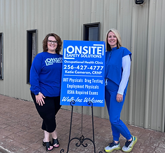 Katie Cameron and Victoria Birdwell in front of Onsite Safety Solutions with business sign