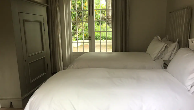 THIRD BEDRROM FACING THE GARDEN WITH 2 SINGLE BEDS