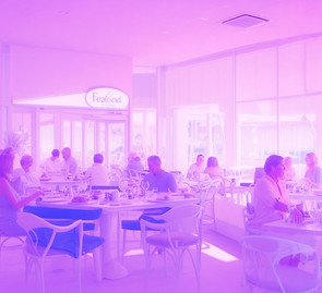 seafood restaurant with customers enjoying meals at tables near windows.jpg