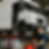 Professional oil change service for commercial trucks in a clean, well-equipped garage