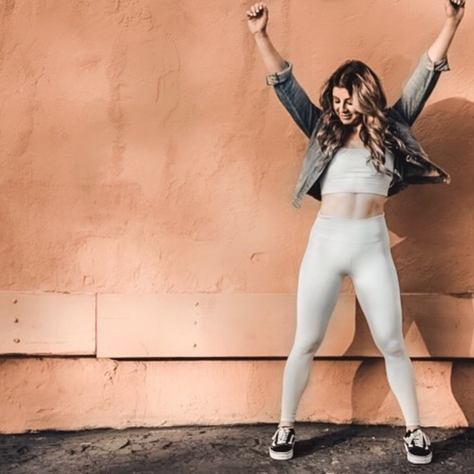 woman safely working out at Sweat Society Fitness while on GLP-1 medication