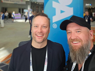 RH1 CEO Claude Rety with partners and suppliers at IAAPA Expo 2025, discussing innovation and industry trends