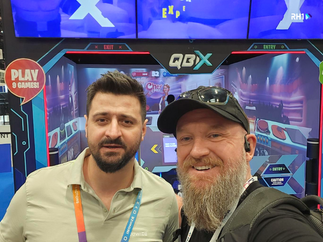 RH1 CEO Claude Rety with partners and suppliers at IAAPA Expo 2025, discussing innovation and industry trends