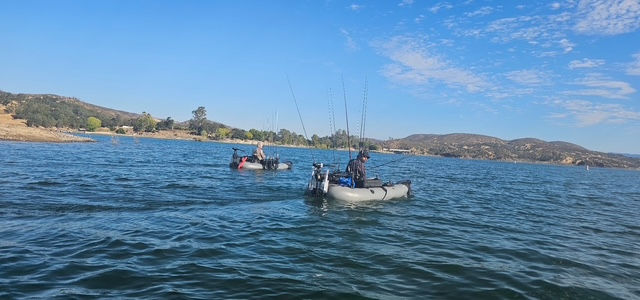 Two Dave Scadden Detonator inflatable fishing boats out on a beautiful lake