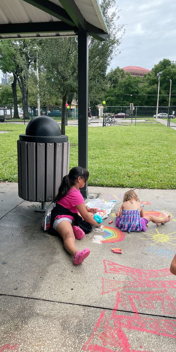 Volunteers distributing meals and essentials at The Greatest Commandment Inc. Summer Event in Orlando 2023.