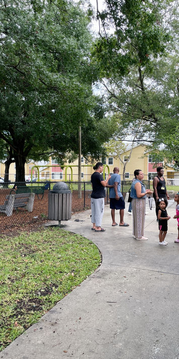 Volunteers distributing meals and essentials at The Greatest Commandment Inc. Summer Event in Orlando 2023.