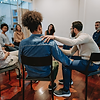 Friends Supporting Each Other in a Meeting
