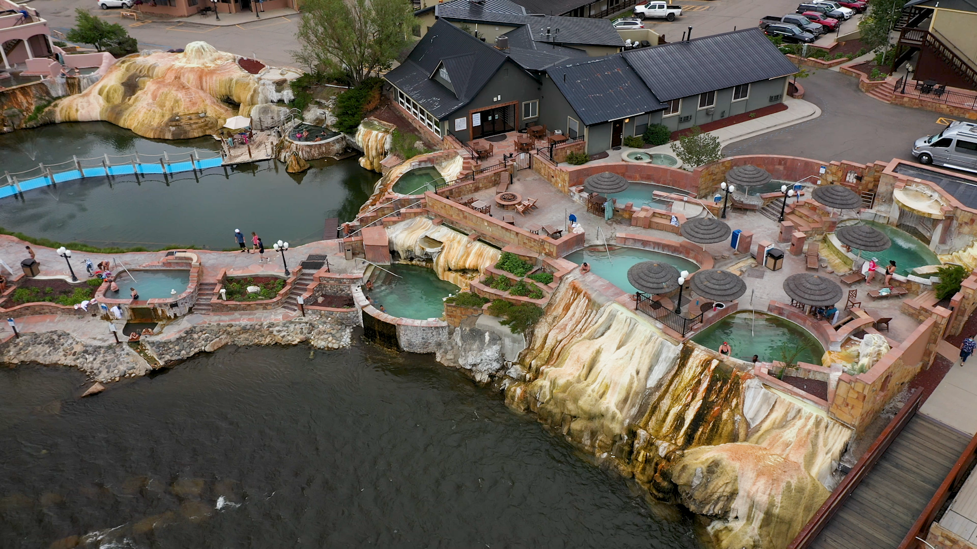 An aerial view of The Springs Resort & Spa in Pagosa Springs, Colorado and the ensemble of 25 soaking pools on the Sauna Channel