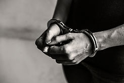 criminal in handcuffs.jpg