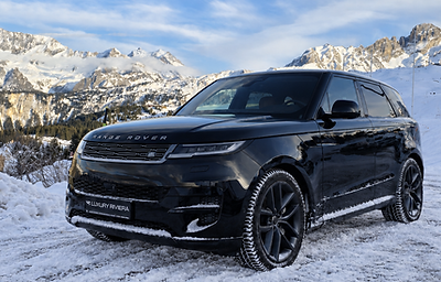 Glossy black Range Rover in snowy mountains-1.png