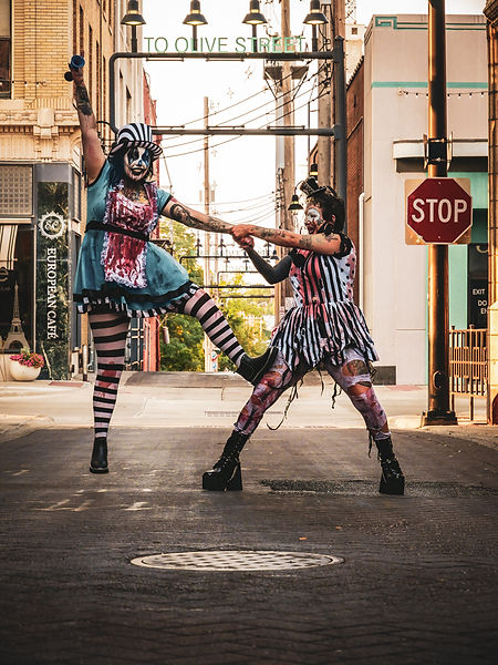 Photo taken by Living Lens Media of two women from a hunted house dancing in an alley