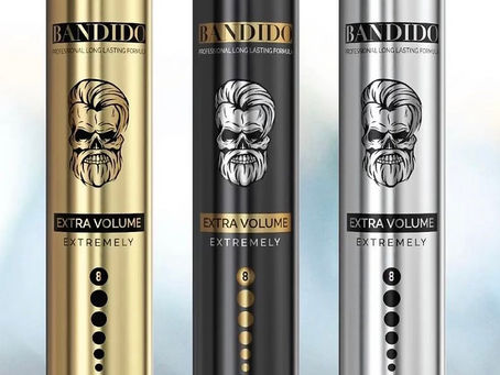 Three Bandido Long Lasting Hair Spray bottles in black, gold, and silver variations — professional styling products for barbers.