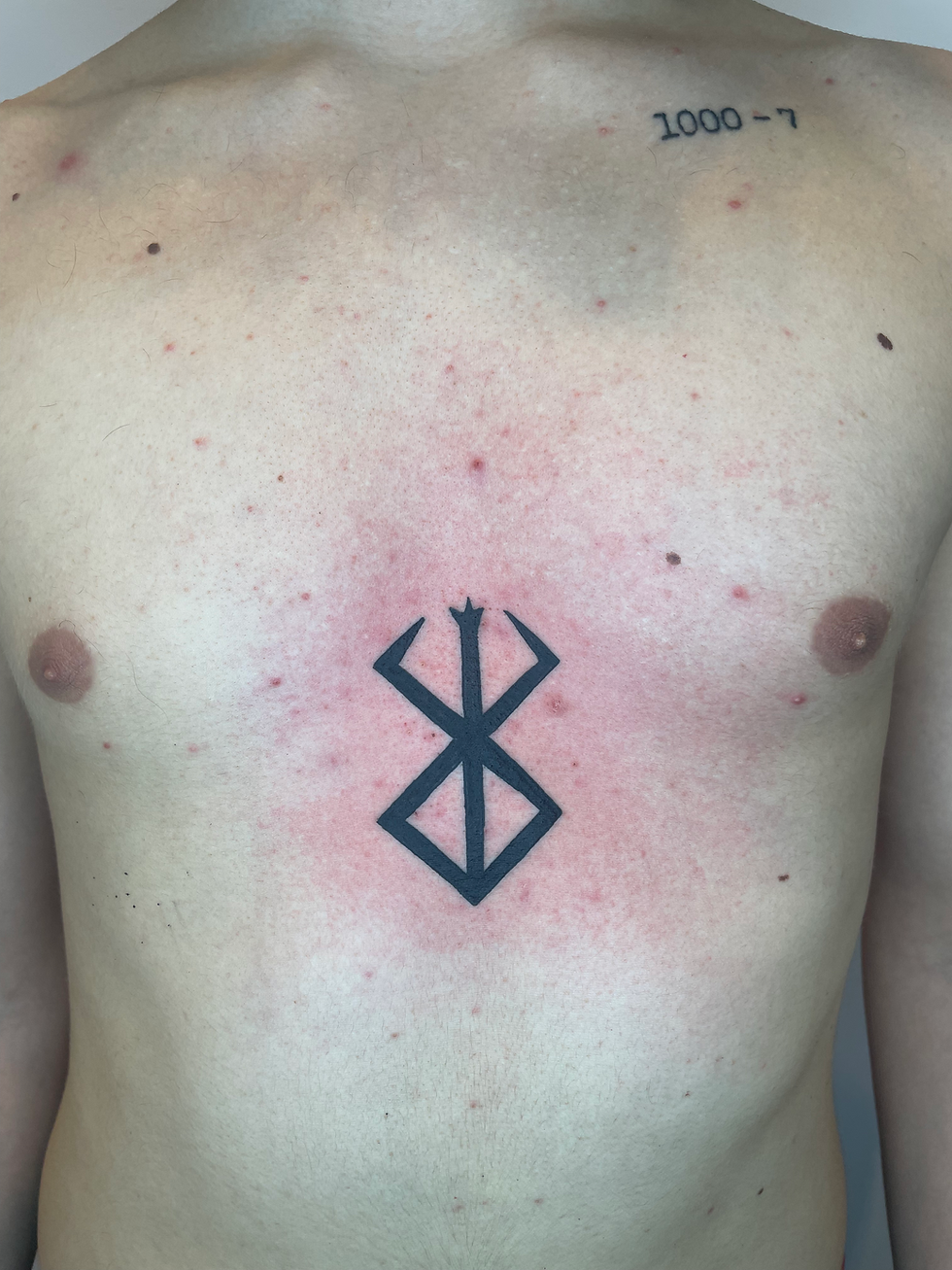 Polynesian-inspired blackwork tattoo showing thick lines and cultural symbolism.