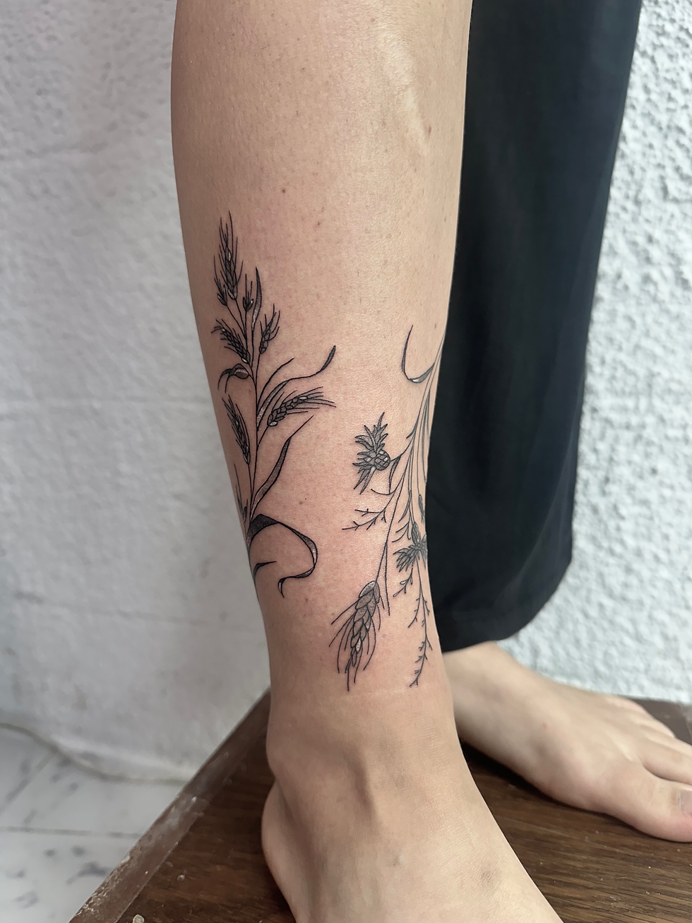 Flowers on stem tattoo design by Mike Plebanski at We The Sinner Tattoo in Malta