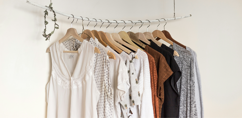 Eye-level view of a neatly arranged wardrobe with versatile clothing pieces